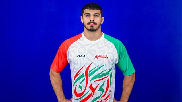 قهرمان آسیا و تقدیم مدال به شهدای میناب